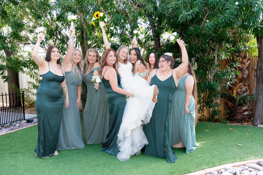 Elegant bridal party portrait in the garden area at Mon Bel Ami Wedding Chapel.