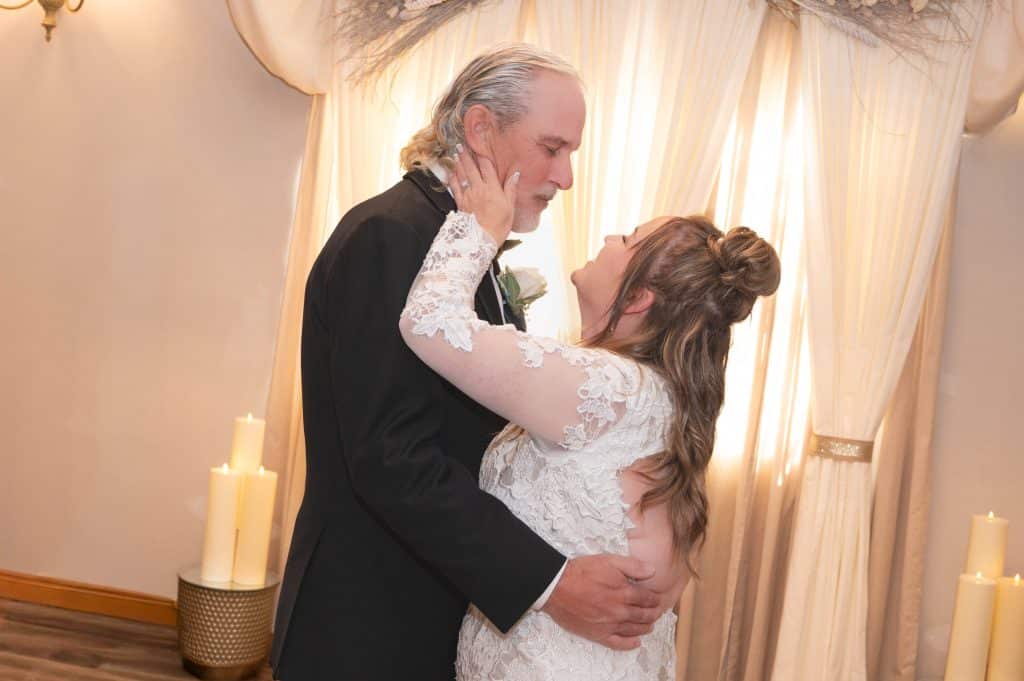 Bride smiling at groom during first dance at Mon Bel Ami Wedding Chapel.
